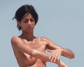 Skinny young nudist caught on a secret camera on a hot summer day